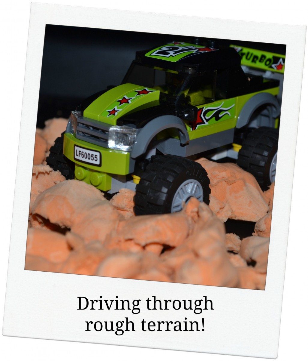 Lego Monster Truck driving through Moonsand