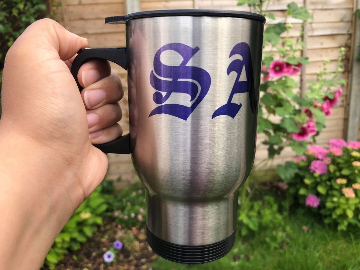 Personalised travel mug with SA initials